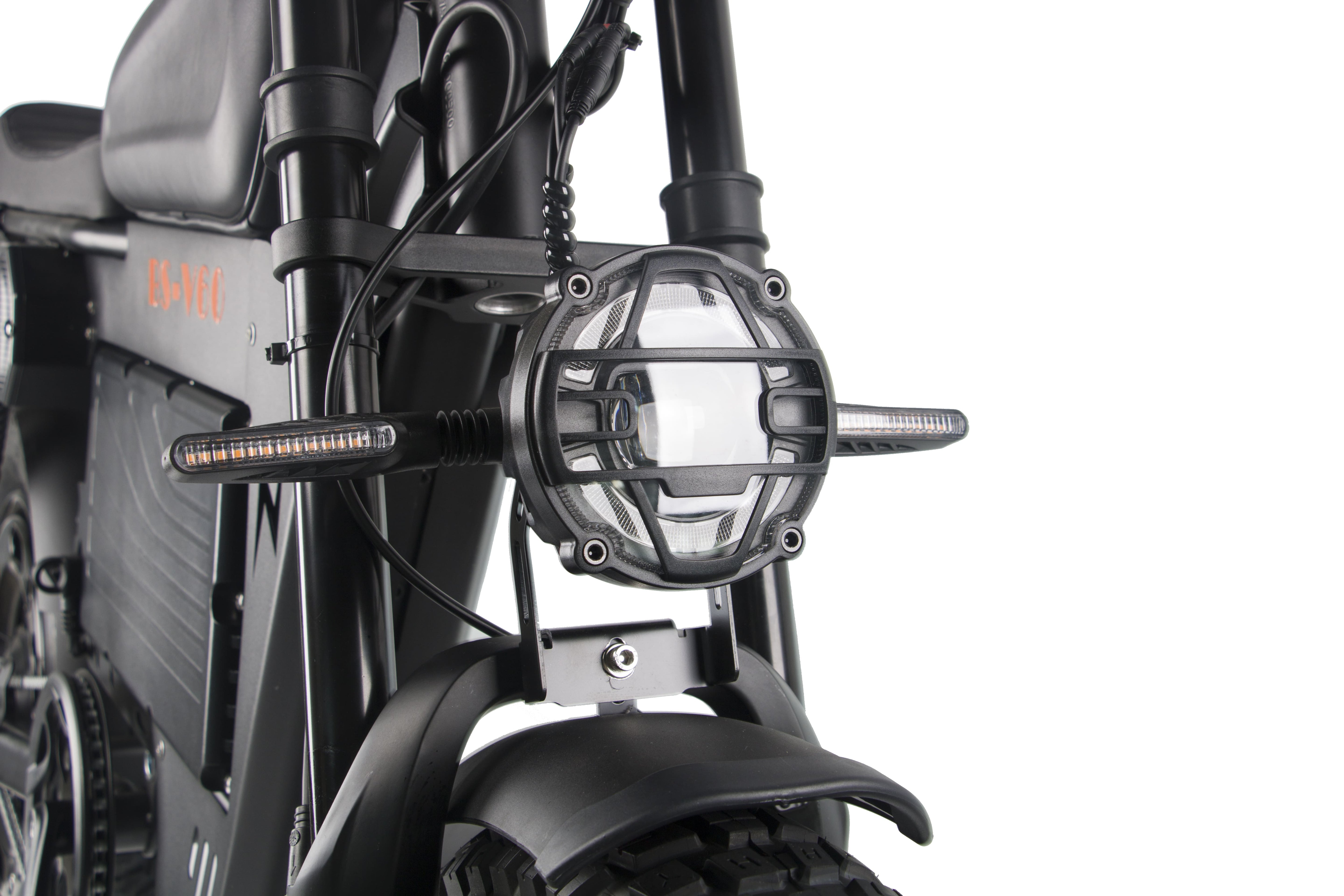 Front headlight housing and fork area on a black electric motorcycle.
