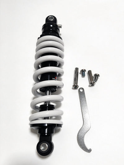 QF200 shock absorber with white coil spring, black body, wrench and mounting bolts