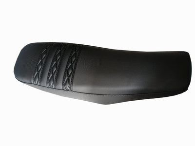 Black dirt bike seat with stitched ribbed pattern on top