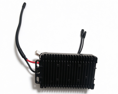 Black electronic controller module with heatsink fins and connected cables/antenna leads