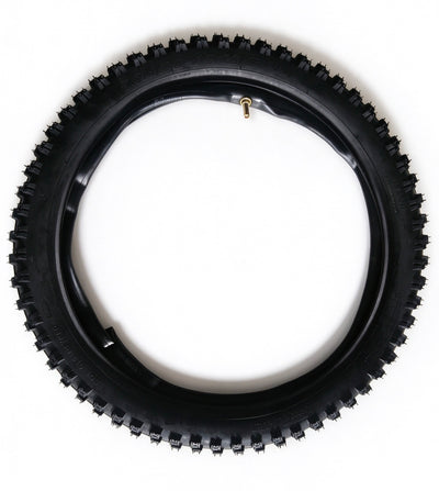 QF200 tire with black knobby tread and gold valve stem, viewed from above