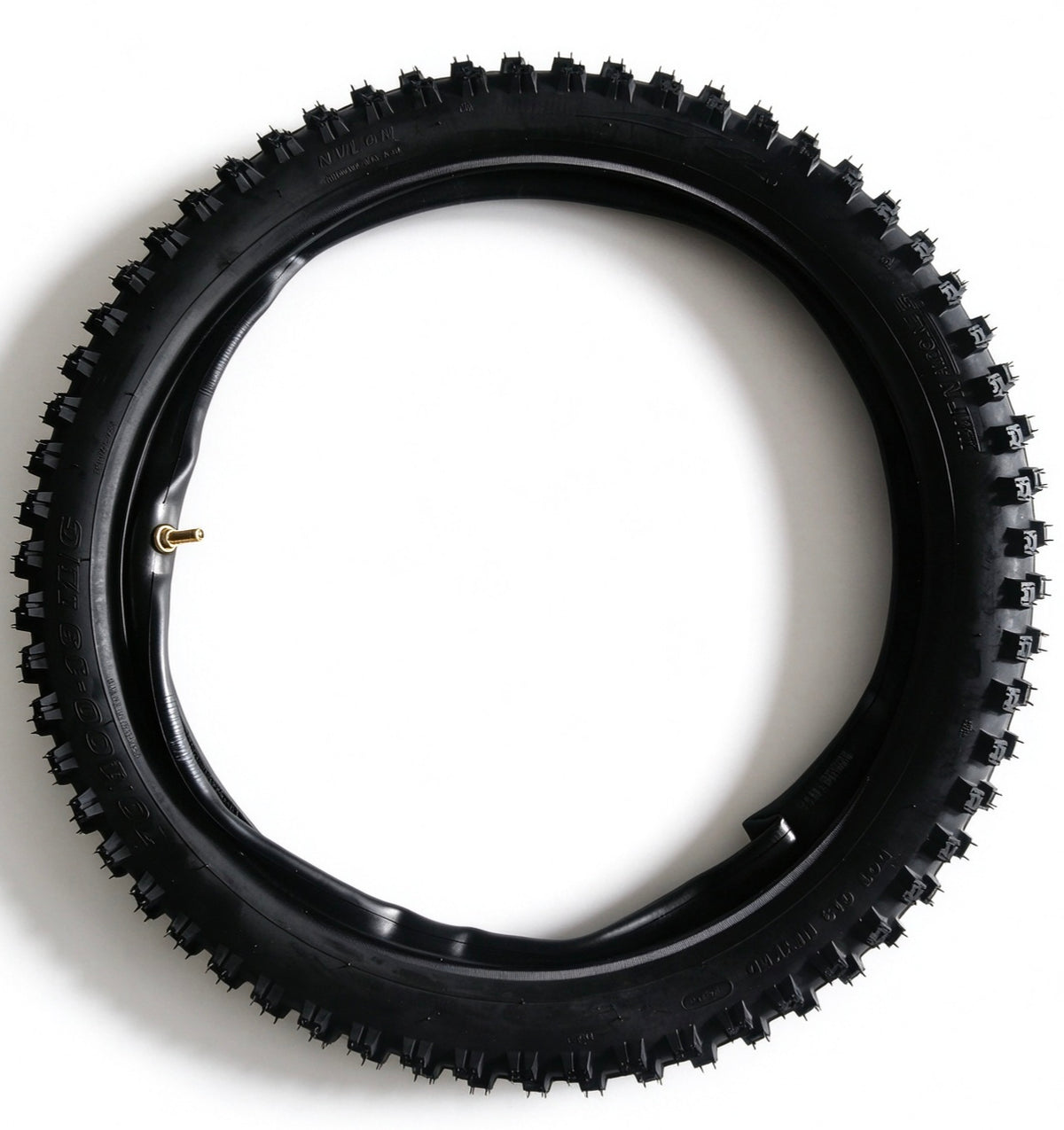 QF200 tire with black knobby tread and gold valve stem, angled overhead view