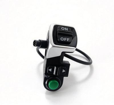 QF200 lighting switch with ON/OFF rocker and green button, viewed from the front