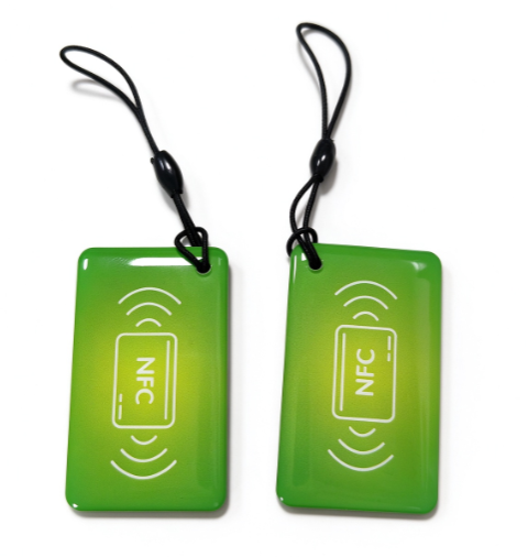Green NFC keychain access tag with lanyard cord and NFC symbol