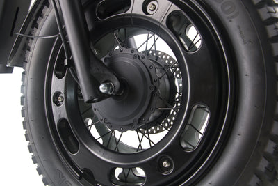 Black front wheel hub and brake rotor on a black electric motorcycle.